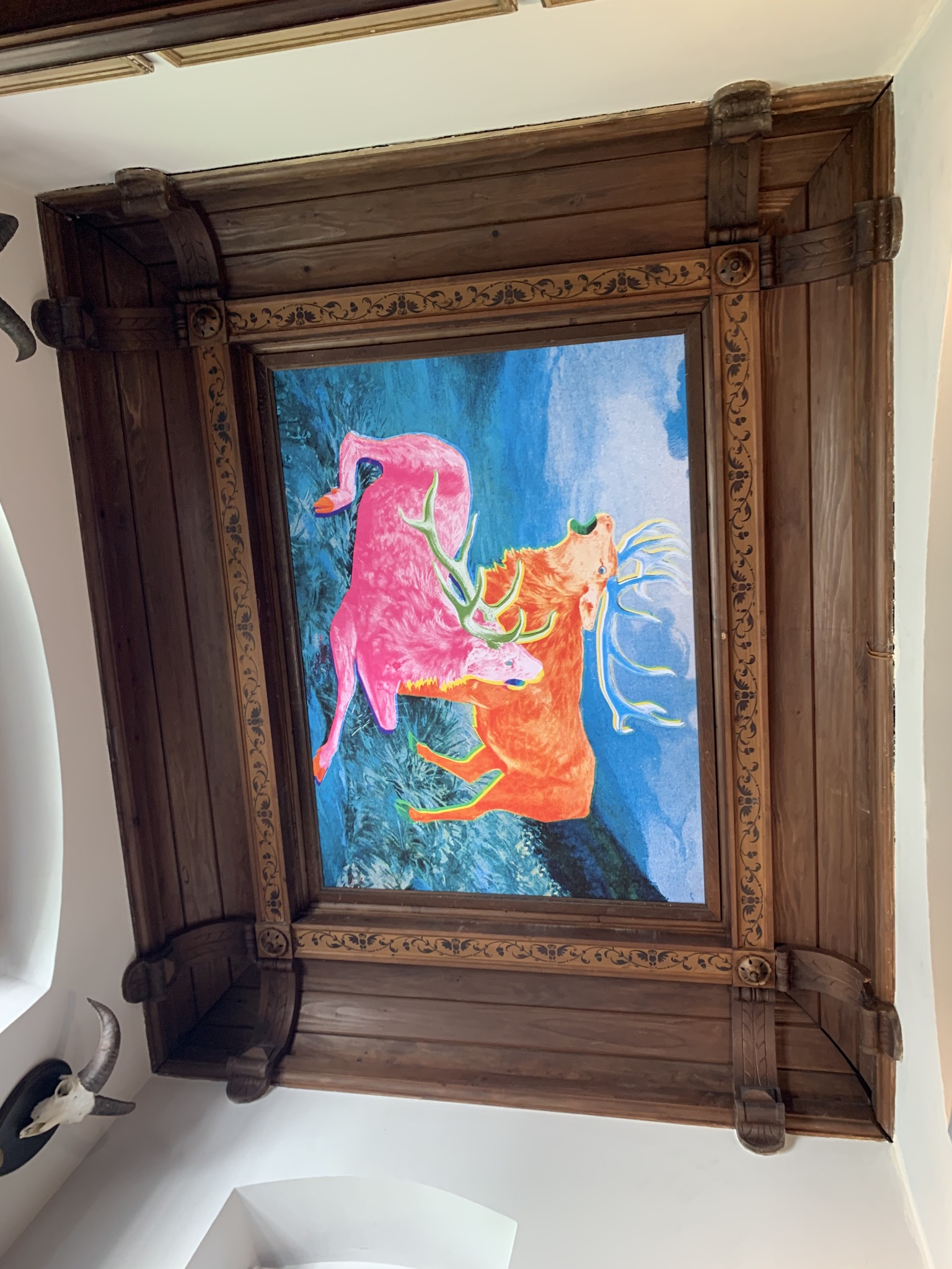 Complete Funky Hunting ceiling artwork within the carved timber surround